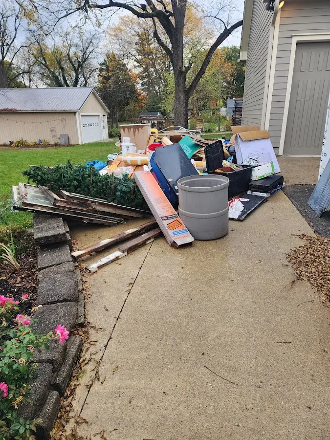 Dumpster being loaded with debris for Residential Dumpster Rental in Atascocita